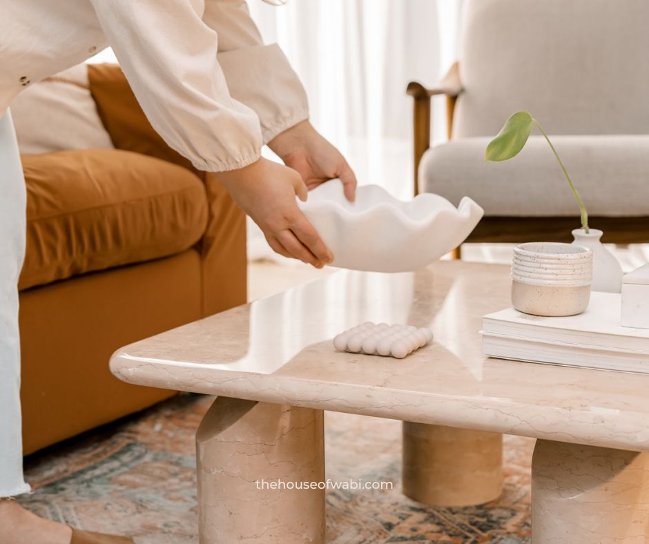 A mindful home design includes curated items for a coffee table vignette