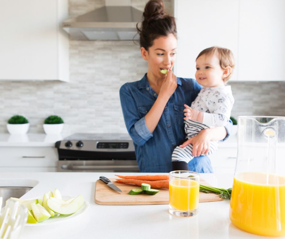 Mom and baby in a modern, white kitchen designed for their lifestyle.